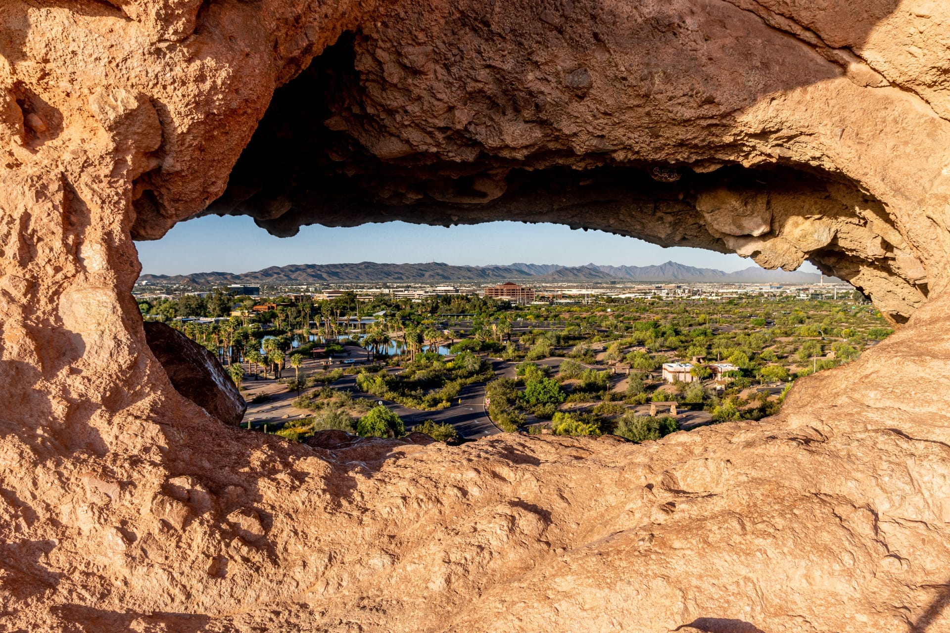 Capture of Phoenix cityscape through a unique rock formation in Papago Park, Arizona