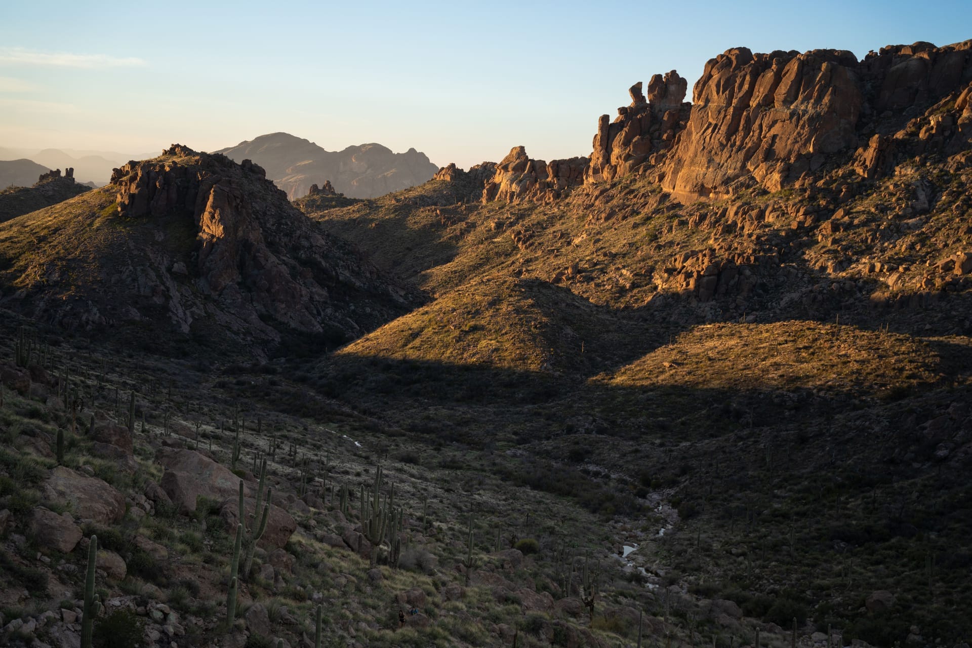 Breathtaking view of Superstition Mountains in Arizona during sunset, showcasing rugged peaks and desert landscape — Paradise Valley, ZIP 85253