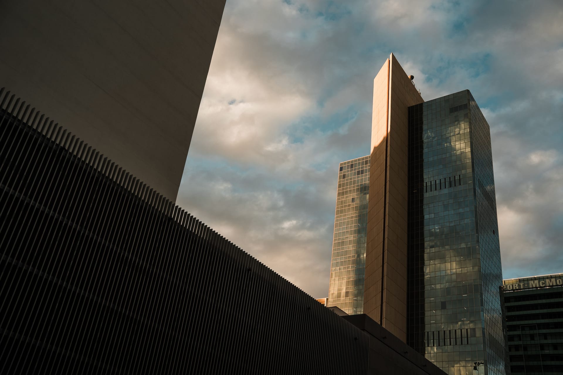 Tall skyscrapers in downtown Phoenix reflecting the sunset sky, showcasing modern architecture